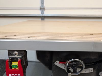 An image of the edge of the table saw cover