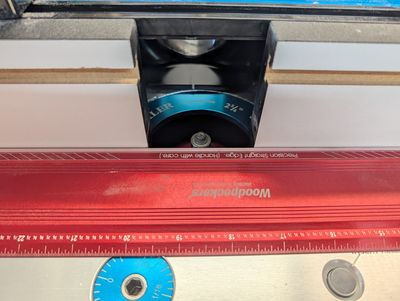 An image of a router table fence and straight edge ruler