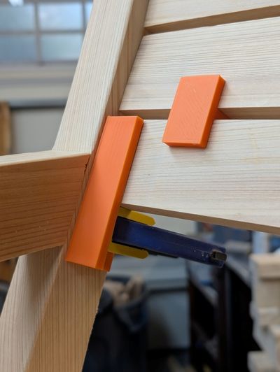 an image of a jig holding a slat in place
