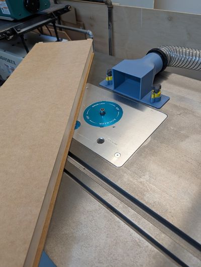 Using the router to trim away excess panel