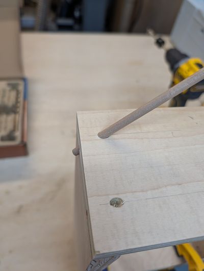 A dowel poked through a hole